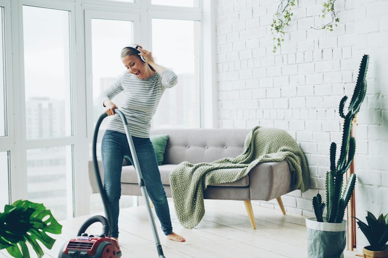 Vacuuming a bright, tidy living room