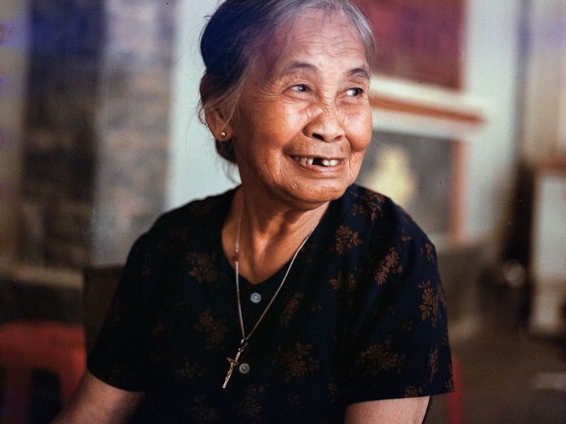 A smiling older woman at home